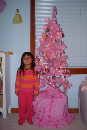 Kasen posing with her pretty pink tree